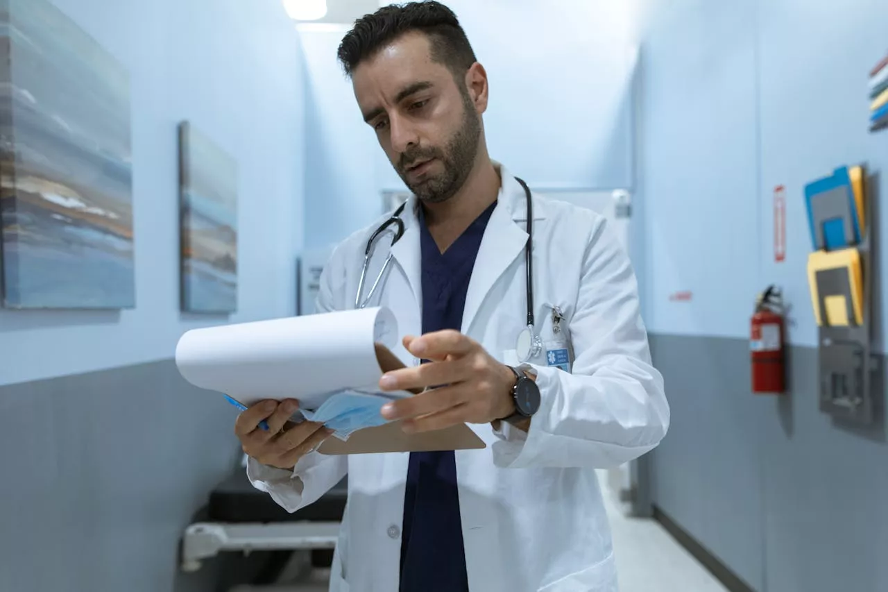 Florida physician reviewing financial documents during a divorce involving medical practice valuation and asset division