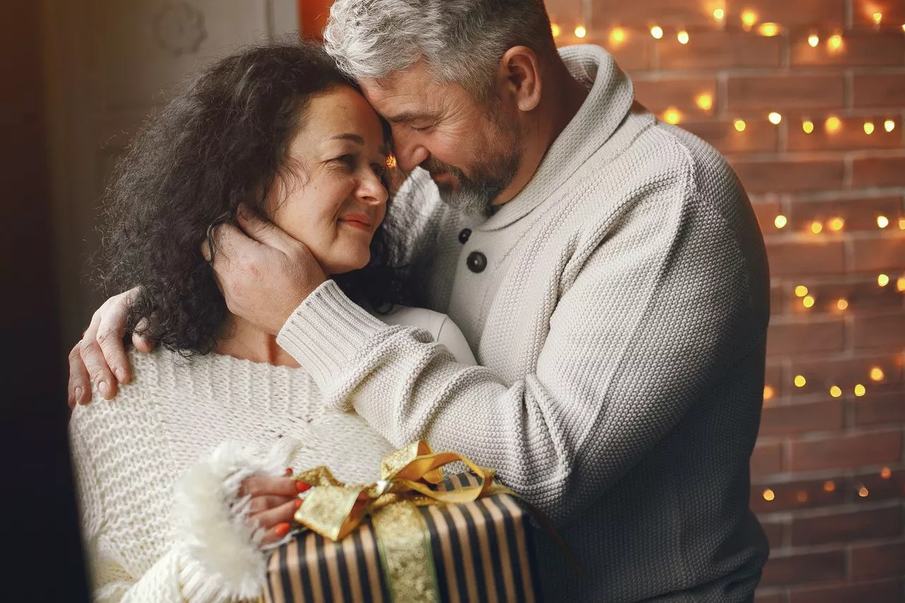 Married couple discussing financial documents representing a postnuptial agreement in Florida.