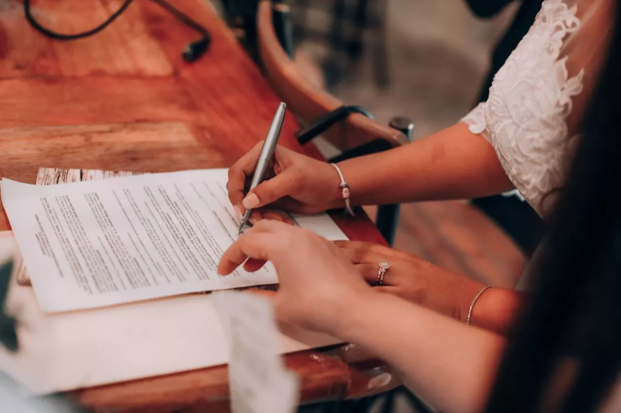 Business owner signing a prenuptial agreement to protect business assets before marriage in Florida.