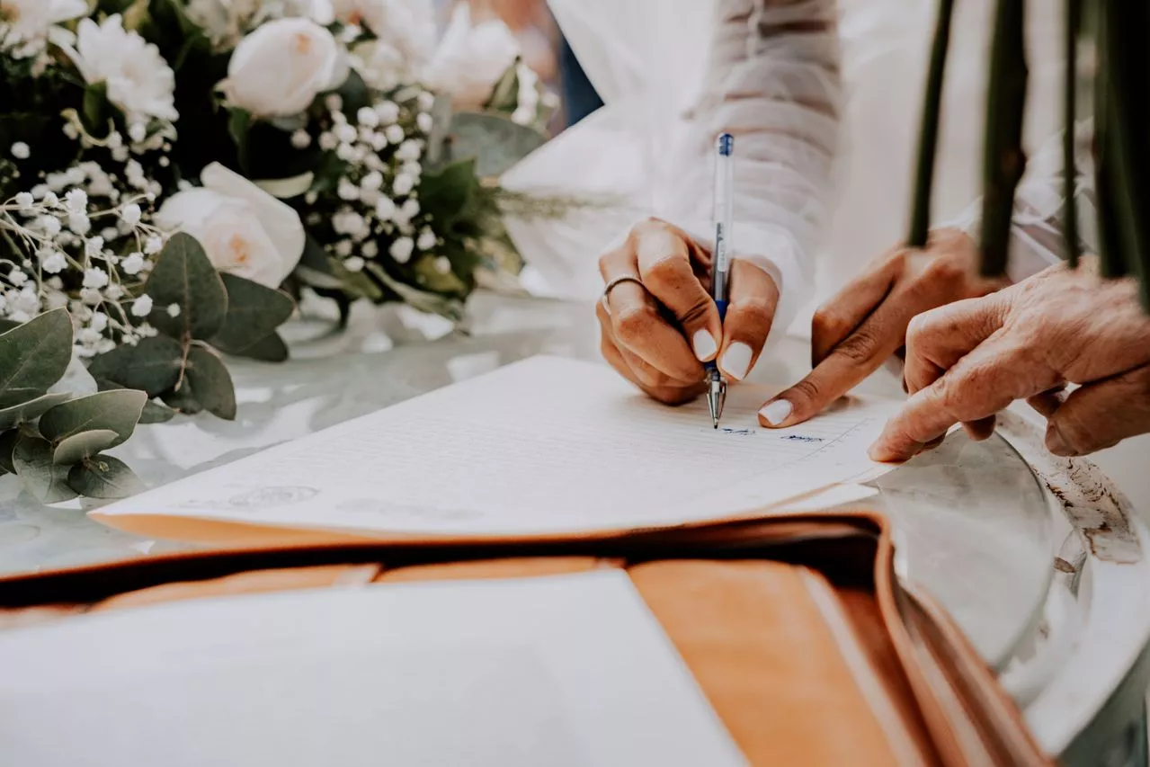 Couple signing a Florida prenuptial agreement with an attorney